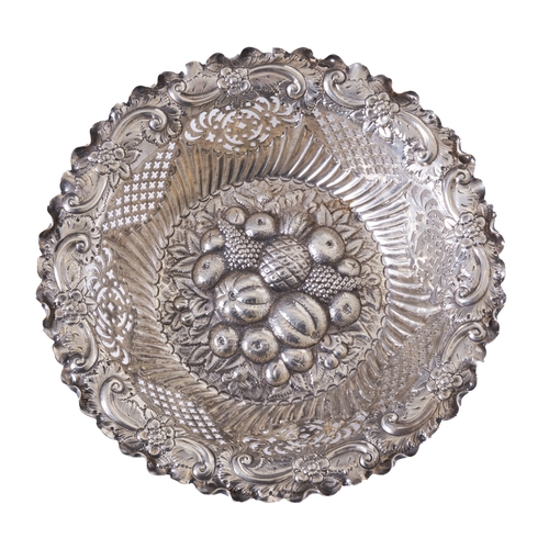 446 - Early 20th CenturyA hammered and pierced silver fruit bowlDecorated with hammered fruit motifsTo be ... 