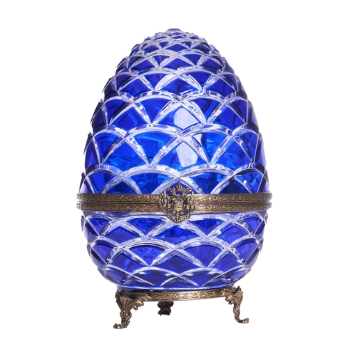 457 - French20th CenturyA Faberge caviar and vodka setThe cobalt egg-form hinged case with embossed brass ... 