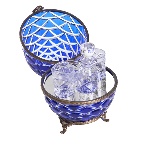 457 - French20th CenturyA Faberge caviar and vodka setThe cobalt egg-form hinged case with embossed brass ... 