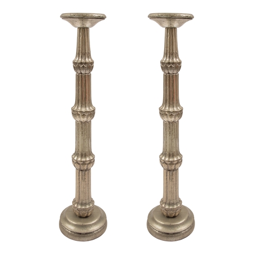 458 - 20th CenturyA pair of large pricket candlesticksWith a silver repoussé finishDimensions:36 in. (H) x... 