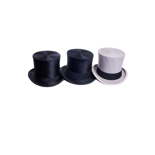 488 - 20th CenturyA group of three top hats[a] A Delicon black silk top hat[b] A Woodrow black silk top ha... 