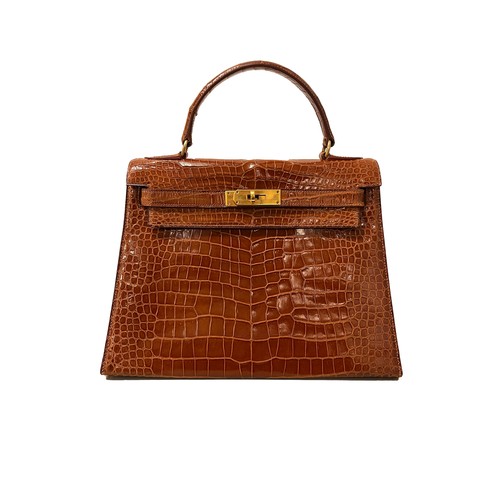12 - Hermès1957A Kelly 28 miel crocodile leather handbag Stamped to the underneath with Hermès 'M' markTh... 
