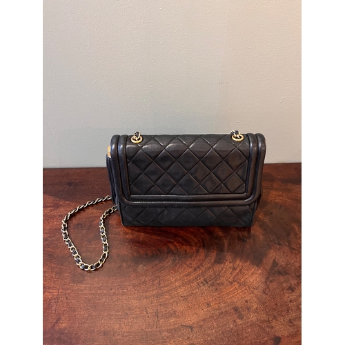 13 - ChanelVintageA black quilted leather tassel flap bagWith Chanel card of authenticity Dimensions... 
