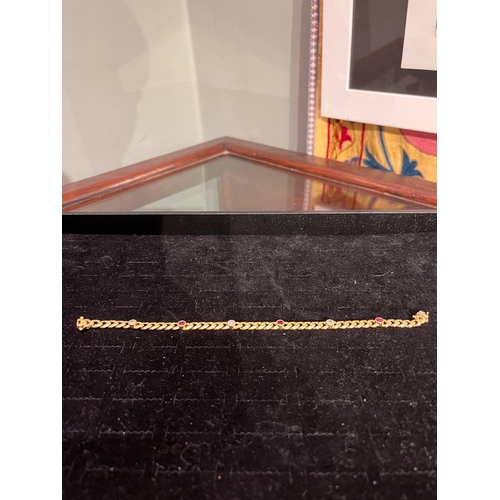 29 - EuropeanCirca 1980A ruby and diamond bracelet18ct gold curb link bracelet Set with 6 alternate ... 