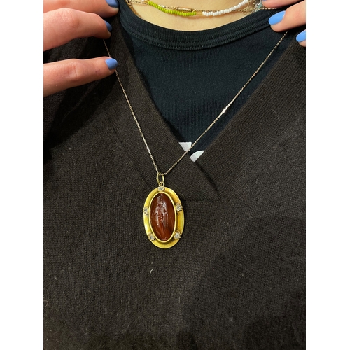 64 - A large Greek oval carnelian intaglio pendant of a Greek female figureMost likely a Goddess holding ... 