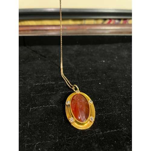 64 - A large Greek oval carnelian intaglio pendant of a Greek female figureMost likely a Goddess holding ... 