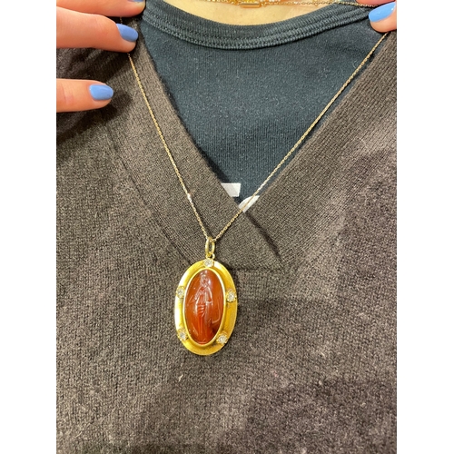 64 - A large Greek oval carnelian intaglio pendant of a Greek female figureMost likely a Goddess holding ... 