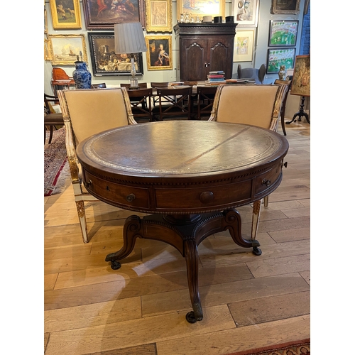 221 - 19th CenturyA drum table with embossed and gilt leather top. Tapering octagonal faceted column onto ... 