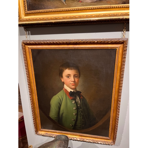 258 - Attributed to Sir Nathaniel Dance-Holland (1735 - 1811)Portrait of a boy in green coat in a feigned ... 