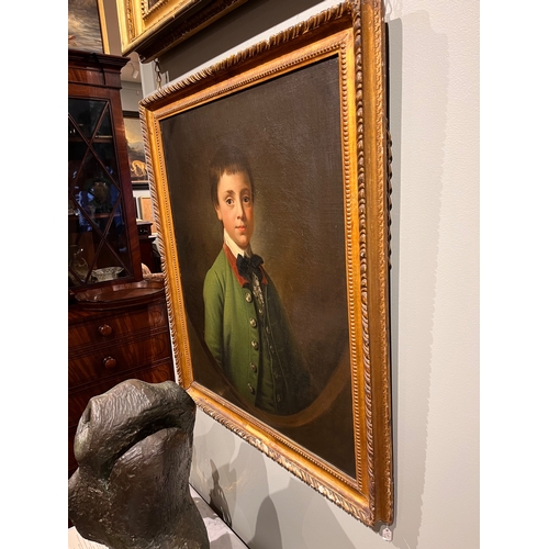 258 - Attributed to Sir Nathaniel Dance-Holland (1735 - 1811)Portrait of a boy in green coat in a feigned ... 