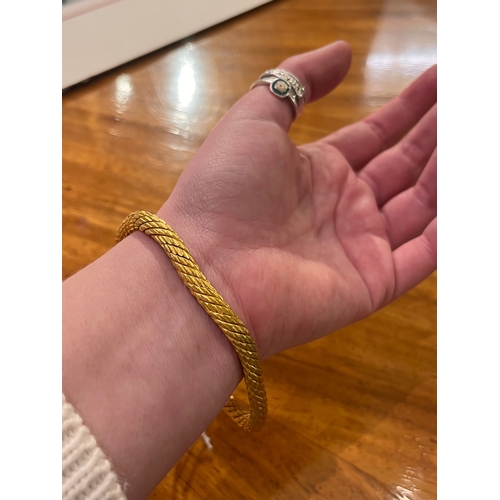 10A - Middle Eastern circa 1890A heavy high carat yellow gold snake Torq bangleTotal weight:Approx 105 gra... 
