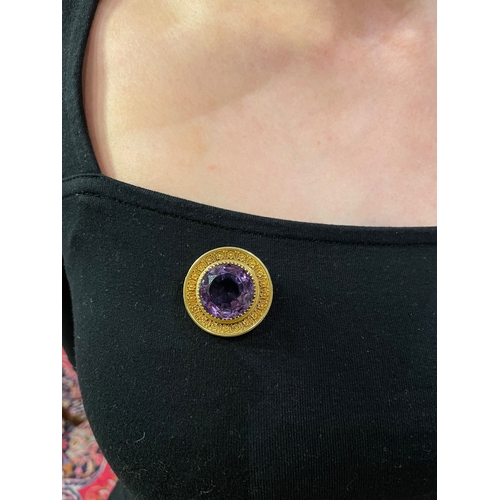 70 - EnglishCirca 1870An amethyst and gold cannetille work pendant broochWeight:Approx. 15 gramsDimension... 