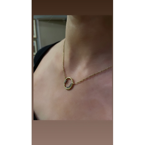 82 - BritishCirca 1980A small 18ct gold and diamond circle necklaceWeight:Approx: 6gramsDimensions:(chain... 