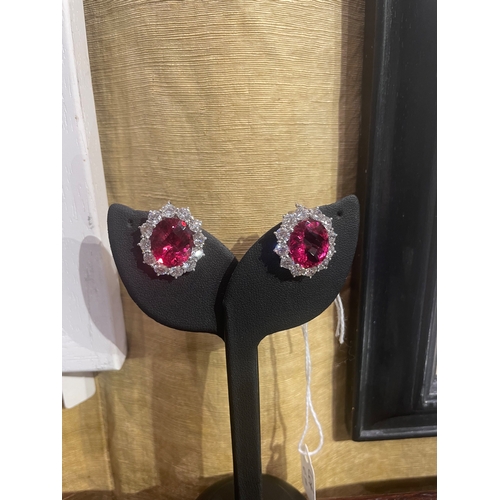 67 - An impressive pair of pink tourmaline and brilliant cut diamond cluster earringsThe oval briollete p... 