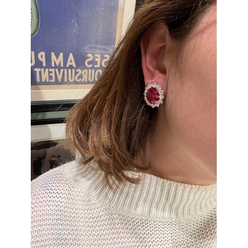 67 - An impressive pair of pink tourmaline and brilliant cut diamond cluster earringsThe oval briollete p... 