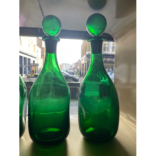 459 - 20th CenturyFour handblown green glass bottles with stoppersProperty of a noblemanDimensions:13 in. ... 