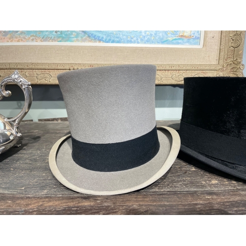 488 - 20th CenturyA group of three top hats[a] A Delicon black silk top hat[b] A Woodrow black silk top ha... 