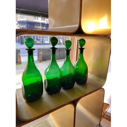 459 - 20th CenturyFour handblown green glass bottles with stoppersProperty of a noblemanDimensions:13 in. ... 