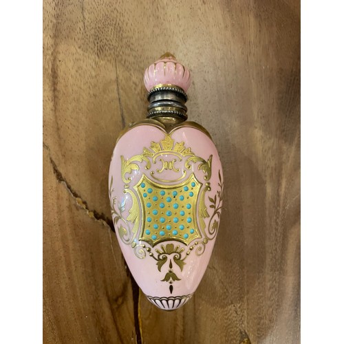 10B - Royal WorcesterA heart shaped scent bottle in pink and giltDimensions:4.5 in. (H) x 2 in. (W)... 