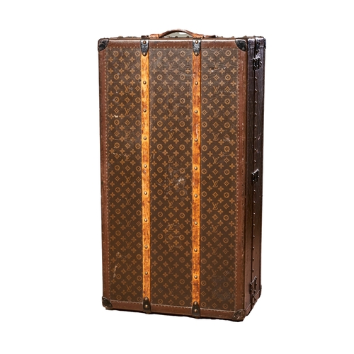 82 - Louis VuittonEarly 20th CenturyA monogram canvas 'Malle Armoire' wardrobe trunkBrass studded wooden ... 