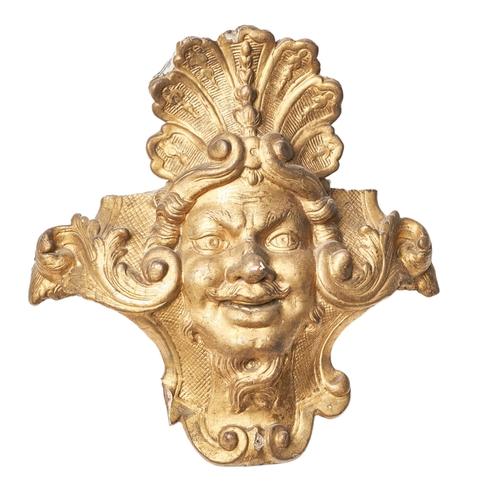 66 - BritishEarly 18th CenturyA carved giltwood mask furniture elementProvenance: Ossowski, Pimlico Road
... 