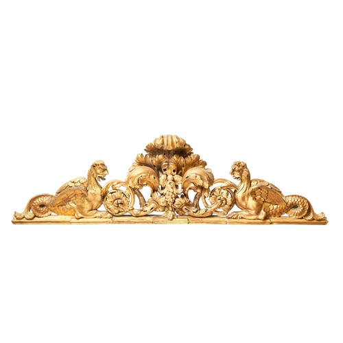 70 - Italian19th CenturyA carved giltwood architectural elementThe central floral swags supported by myth... 