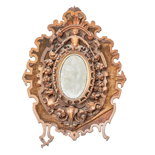 73 - Italian19th CenturyA small mirrorIn a carved surround, with putto and floral motifsProvenance: Ossow... 