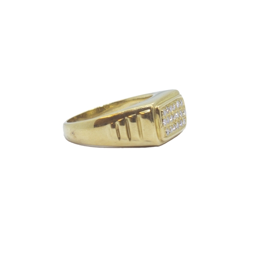 98 - ItalianCirca 1980An 18 carat gold and diamond dress ringThe rectangular top pave is set with brillia... 