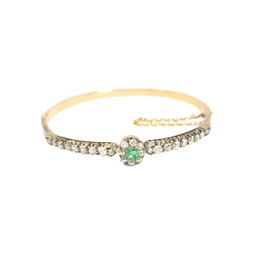 109 - BritishCirca 1880A pretty emerald, diamond and 18 carat rose gold bangleIn the original toulled leat... 