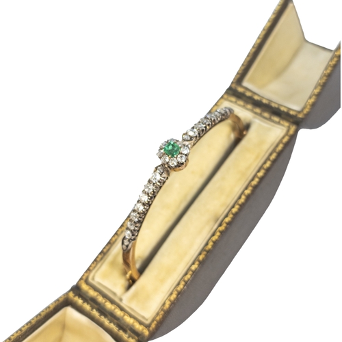 109 - BritishCirca 1880A pretty emerald, diamond and 18 carat rose gold bangleIn the original toulled leat... 