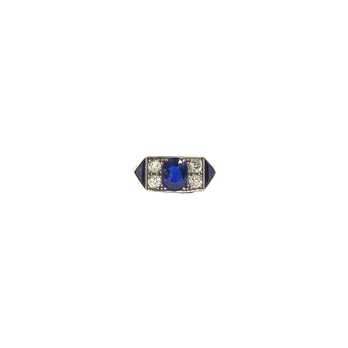 119 - BritishCirca 1920A fine sapphire and diamond ringThe oval shaped central sapphire weighing approxima... 