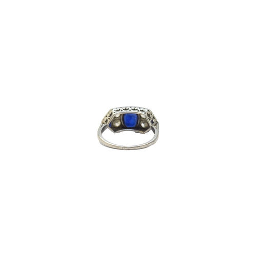 119 - BritishCirca 1920A fine sapphire and diamond ringThe oval shaped central sapphire weighing approxima... 