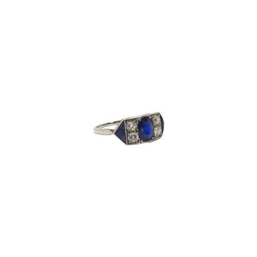 119 - BritishCirca 1920A fine sapphire and diamond ringThe oval shaped central sapphire weighing approxima... 