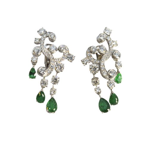 125 - EuropeanCirca 1980A fine and attractive pair of diamond and emerald earringsThe tops composed of bri... 