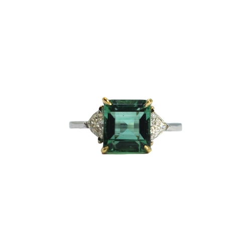 127 - BritishCirca 2000A fine Colombian emerald and diamond ringThe central rectangular emerald of excelle... 