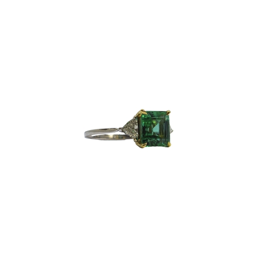 127 - BritishCirca 2000A fine Colombian emerald and diamond ringThe central rectangular emerald of excelle... 