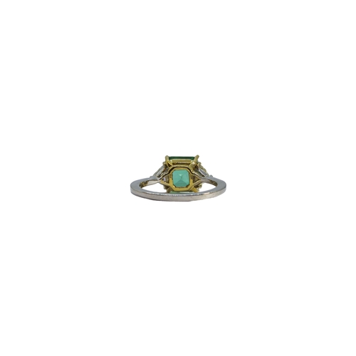 127 - BritishCirca 2000A fine Colombian emerald and diamond ringThe central rectangular emerald of excelle... 