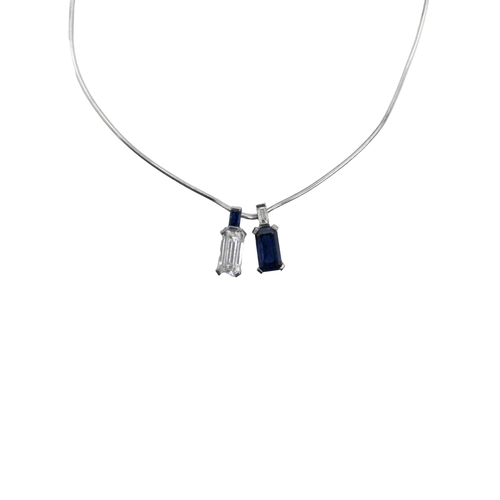 130 - ContinentalCirca 1970A fine emerald-cut diamond and sapphire pendant necklaceThe emerald-cut diamond... 