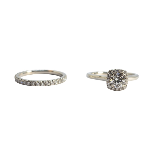 135 - BritishContemporaryA fine diamond cluster ring and matching band ringThe brilliant-cut diamond centr... 