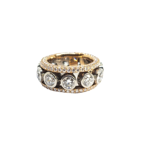 136 - BritishCirca 2000A fine quality whimsical diamond band ringComprising a line of collett-set brillian... 