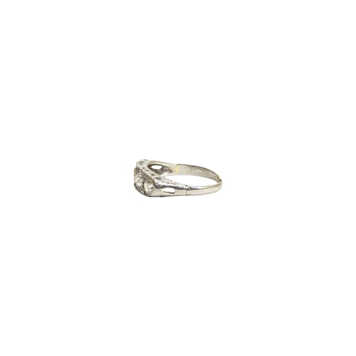 137 - BritishLate 19th CenturyA four stone diamond and platinum half hoop ring, the diamonds weighing appr... 