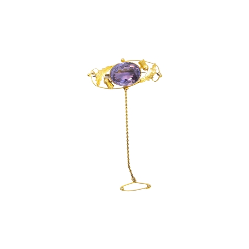 148 - BritishCirca 1880An amethyst and yellow gold broochThe oval shaped central mixed-cut amethyst set wi... 