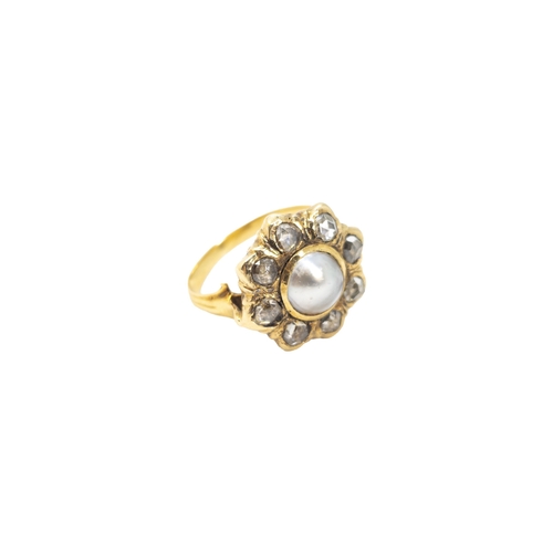 152 - ContinentalCirca 1850A rose-cut diamond and half pearl cluster ringThe central pearl surrounded by 8... 