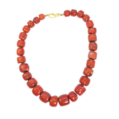 159 - EuropeanCirca 1970A graduated red coral bead necklaceThe necklace composed of 29 graduated barrel-sh... 