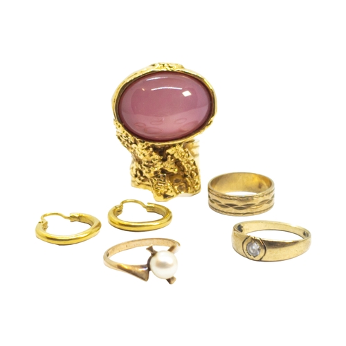 161 - BritishContemporaryA mixed lot of jewellery[a] Yves Saint Laurent, A large faux star ruby and gold d... 