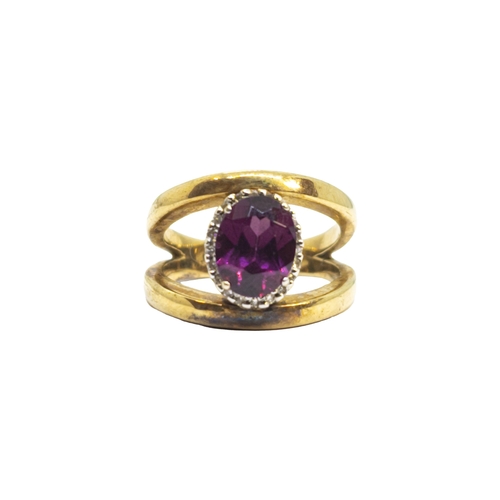 166 - BritishCirca 1980A diamond, red stone and 9 carat yellow gold dress ringWeight: Approx. 6.95 gramsRi... 