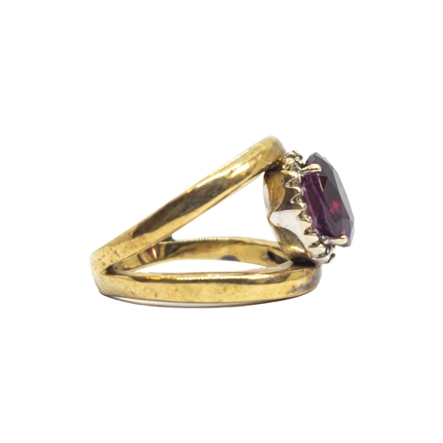 166 - BritishCirca 1980A diamond, red stone and 9 carat yellow gold dress ringWeight: Approx. 6.95 gramsRi... 