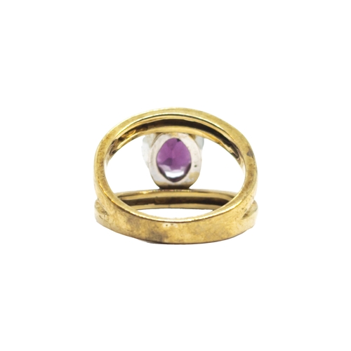 166 - BritishCirca 1980A diamond, red stone and 9 carat yellow gold dress ringWeight: Approx. 6.95 gramsRi... 