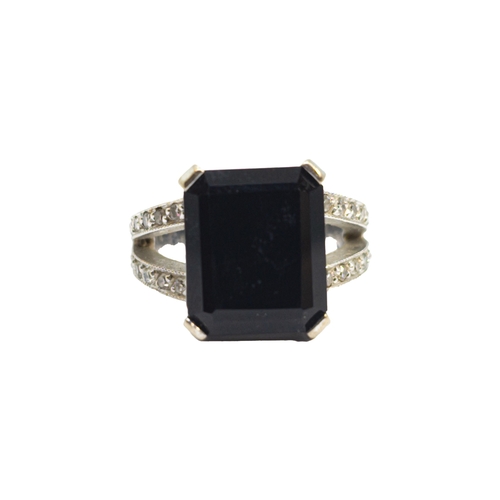 169 - BritishContemporaryAn 18 carat white gold, diamond and black gemstone dress ringWeight: Approx. 9.62... 