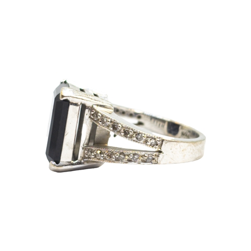 169 - BritishContemporaryAn 18 carat white gold, diamond and black gemstone dress ringWeight: Approx. 9.62... 